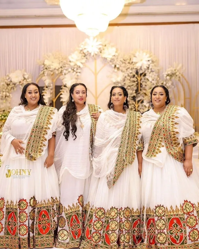 Flowing Multicolored Ethiopian Dress: Luxurious Celebration Attire for Joyful Events