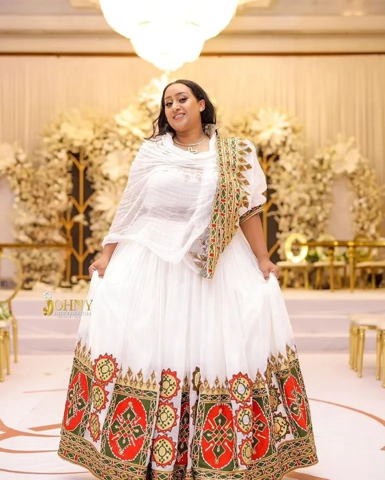 Flowing Multicolored Ethiopian Dress: Luxurious Celebration Attire for Joyful Events